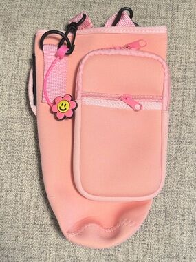 Pink travel cup carrier with straw cover